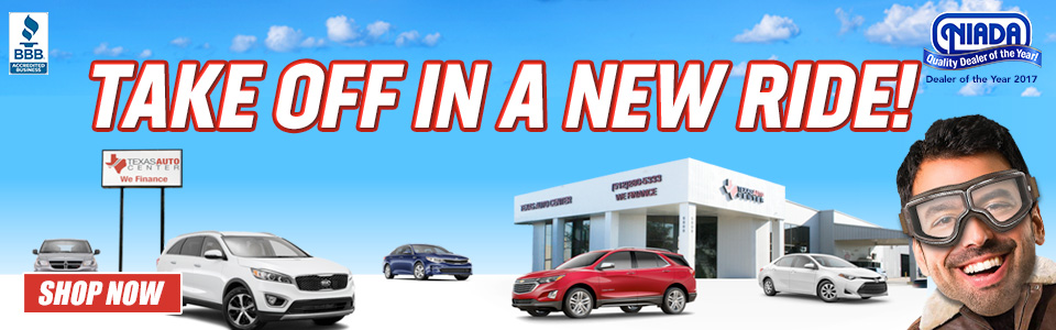 Dealership picture with vehicles and a spokesperson in aviator goggles.